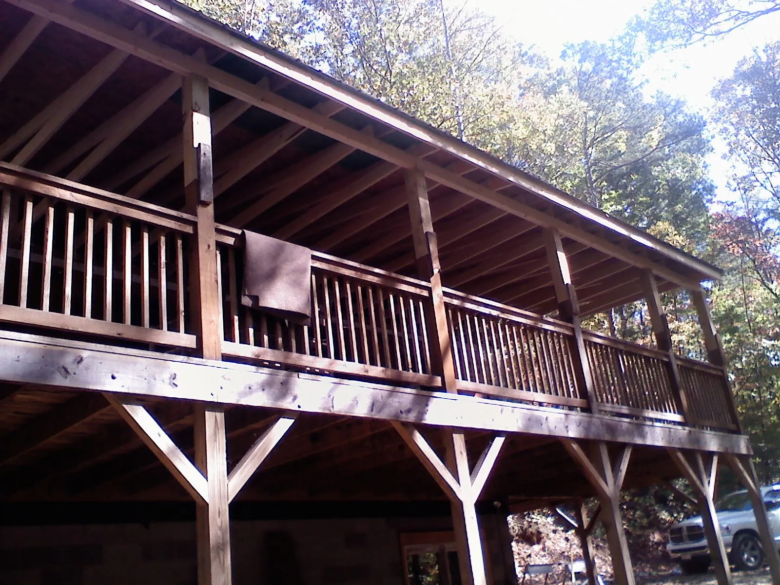 Timber framing under a new elevated porch and deck — Roof Leak Repair in Amery by Roofing Brothers